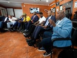 Participants speak during an event June 26 at Rocky's Barber Shop in Atlanta, hosted by the Donald Trump campaign and billed as a "Black American Business Leaders Round Table," in advance of a presidential debate between President Biden and Trump. From left are lobbyist Rufus Montgomery, radio host Shelley Wynter, Rep. Wesley Hunt, R-Texas, Marc KD Boyd, founder of Helping Empower Youth, Rep. Byron Donalds, R-Fla., Rocky Jones, barbershop owner, Ben Carson, former secretary of Housing and Urban Development, and Latron Price, manager of Westside Community Market.