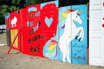 Attendees were encouraged to decorate and inscribe the Doors Of Love art instillation with messages of acceptance, love and support. Many left messages of mourning for those killed in Orlando Sunday, June 12, 2016.