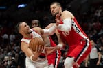 Portland Trail Blazers forward Toumani Camara, left, tries to get around Los Angeles Clippers center Ivica Zubac during the first half of an NBA basketball game, Thursday, Jan. 16, 2025, in Portland, Ore. The Clippers won 118-29.