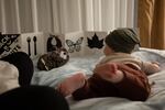 Claire and her 5-month-old son play on a bed at a Comfort Inn and Suites near downtown Vancouver. Claire spent three weeks living out of the hotel as she tried to get her husband help during a mental health break.