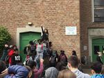 Ockley Green Middle School student Aniyah Johnson (tallest, center) leads a protest over the suspension of teacher Chris Riser over his role in an unauthorized Black Lives Matter school walkout.