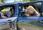 UO junior Ellie Watson photographs acrobat and tumbler Emily Rezner on May 8, 2025, in Eugene, Ore. Watson is part of Oregon Accelerator, a student-run organization helping athletes learn more about Name, Image and Likeness, or NIL, deals.