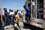 Haitian citizens who were detained by the Dominican Republic's authorities arrive at the Haitian border for deportation, on Wednesday.
