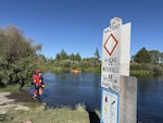 Rescuers stand in the Dillon Falls area near Bend, Ore., on July 19, 2025.