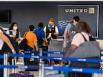 Travelers line up to check in for United Airlines flights at Newark Liberty International Airport on July 1, 2022 in Newark, N.J. Experts are predicting heavy travel this summer.