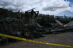 August 13: Police tape surrounds the site of a home destroyed by the Maui wildfires in Kula, Hawaii.