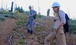 Sydney Watkins (left) and Sara Galbraith hike up a steep slope was that severely burned in 2013.