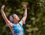Dancers from YZ Dance Academy perform traditional dances while on stage.