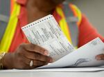 Absentee ballots are prepared to be mailed at the Wake County Board of Elections on Tuesday in Raleigh, N.C.