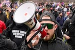 FILE - Proud Boy member Ethan Nordean walks toward the U.S. Capitol in Washington, in support of President Donald Trump on Jan. 6, 2021.