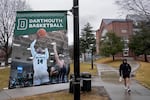 FILE - A student walks near the Alumni Gymnasium on the campus of Dartmouth College, March 5, 2024, in Hanover, N.H.