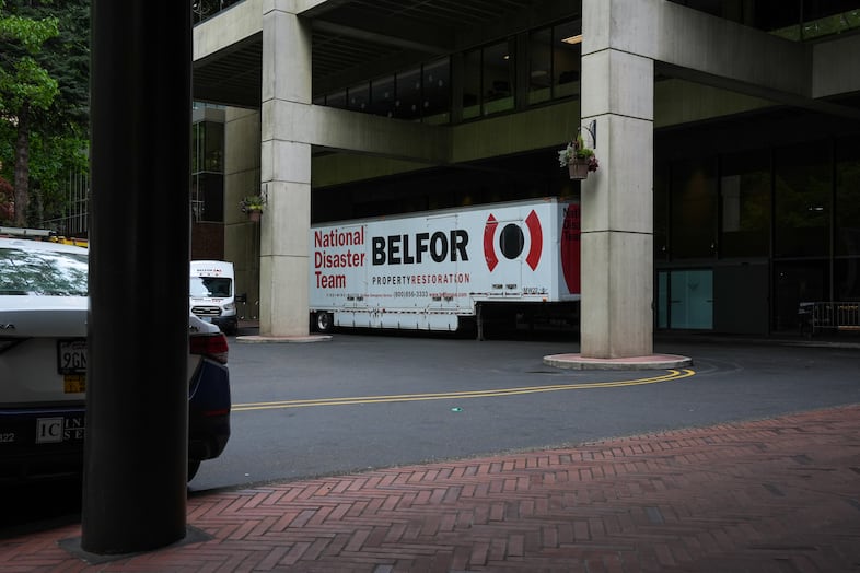 Property restoration trucks sit parked in the Multnomah Athletic Club driveway, where former food and beverage employee Bruce Valentine Whitman crashed a rental car carrying several pipe bombs into the MAC in Portland, Ore., on May 5, 2026.
