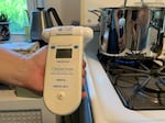 A nitrogen dioxide air monitor in a Philadelphia kitchen on July 16, 2021 shows 0.159 parts per million, or 159 parts per billion. That's above the World Health Organization hourly guideline of 106 ppb.