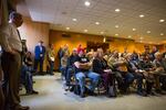 People watch video of testimony on Senate Bill 978 at the Capitol in Salem, Ore., Tuesday, April 2, 2019. An amendment to the bill before the Senate judiciary committee requires safe storage of firearms, allows retailers to refuse some gun sales and more.