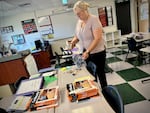 Liz Lopez organizes headsets for her students at Gervais Middle School on Aug. 28, 2024. Lopez is an English language development specialist, working with students who speak Spanish, Russian and other languages.