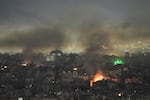 Smoke and flame rise from buildings following Israeli airstrikes in Dahiyeh, Beirut's southern suburbs, Lebanon, Wednesday, March 11, 2026.