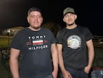 Marlon Espinoza, 32, and Daniel López, 24, pose for a portrait at the tomato farm where they work near Newport, Tenn.