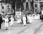 Ku Klux Klan stages an "America First" parade in Binghamton, New York, circa 1920s.