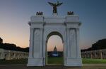 A scaled-down replica of Trump's proposed arch frames the U.S. Capitol at the Great American State Fair.