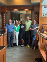 Samuel with his former colleagues at the beer company Dan Henry Distributing in Lansing, Mich.