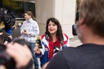 Occupation supporter Maureen Valdez speaks to media holding a pocket Constitution following the deliverance of a not guilty verdict for seven defendants in the occupation of the Malheur National Wildlife Refuge.