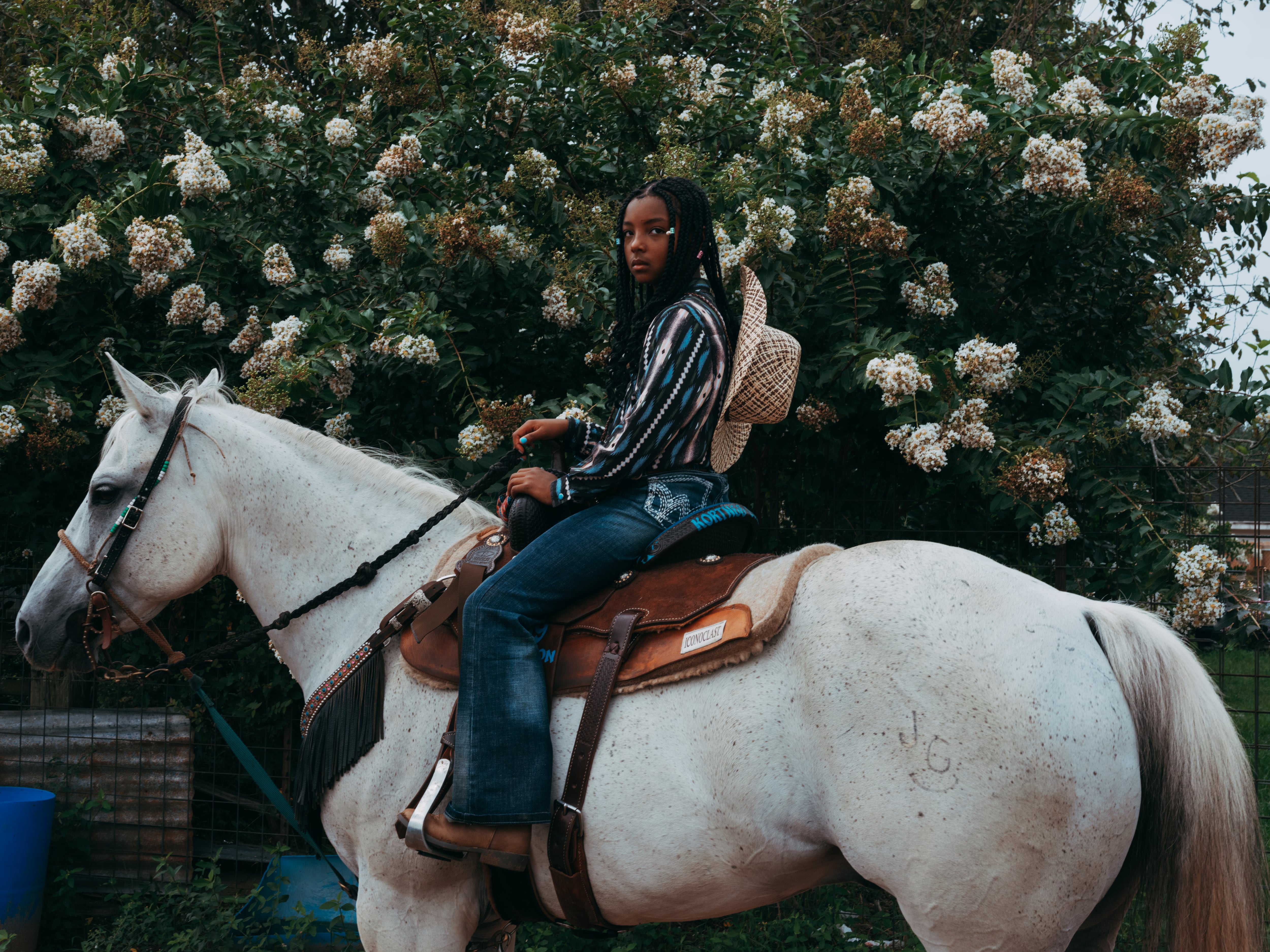 Barrel racer Kortnee Solomon is photographed on her horse.