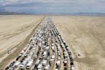 Vehicles seen departing the Burning Man festival in Black Rock City, Nev., in September 2023.