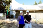 Pastor Jennifer Brownell and Ken Rowe in front of the First Congregational Church of Christ in Hazel Dell. In May 2016, it was one of three churches in Clark County that were struck in a series of church arson fires.