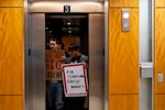 Portland State University Faculty Association rally participants get into an elevator going up to PSU President Ann Cudd’s office in downtown Portland, Ore., on Thursday, Oct. 16, 2025.