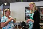 Jenny Glass, Executive Director of the Rosewood Initiative, talks with Cyndi Thompson, a community member.