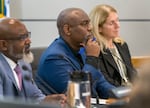 FILE - Portland Public Schools Board of Education Chair Gary Hollands, center, listens to comments during a board meeting at the PPS district office in Portland, Nov. 7, 2023. 