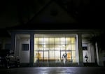 FILE-A person wrapped in an emergency warming blanket stands outside Portland Central Church of the Nazarene in Southeast Portland, Ore., Nov. 19, 2024. The church offers overnight shelter for up to 45 guests and provides food and blankets to those they do not have space for. 