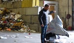 Rogue Waste System's Scott Fowler pulls non-recyclable trash out of the co-mingled recycling mix.