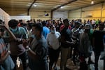 Migrants who've just been released by immigration authorities prepare to continue their journeys at Mission: Border Hope in Eagle Pass, Texas in September.