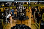 Employees work on the assembly line at the Ford Dearborn Truck Plant Final Assembly Department in Dearborn, Mich., on Sept. 7, 2022.