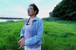Wampanoag journalist Paula Peters chose to be photographed at a marsh near her home in Cape Cod.