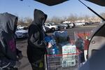 Shoppers load up on supplies at a Portland Costco store on March 19, 2020.