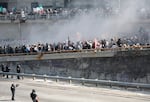 California Highway Patrol officers work to clear protesters blocking the 101 freeway on June 8, 2025, in Los Angeles. Tensions in the city remain high after the Trump administration called in the National Guard against the wishes of city leaders following two days of clashes with police during a series of immigration raids. (Photo by Mario Tama/Getty Images)