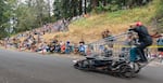 The Volcanica soapbox teams flies by attendees, being first in its race.