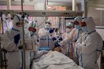 A patient infected with COVID-19 is treated in one of the intensive care units (ICU) at the Severo Ochoa hospital in Leganes, outskirts of Madrid, Spain, Friday, Oct. 9, 2020. Spain has become the first western Europe to accumulate more than 1 million confirmed infections as the country of 47 million inhabitants struggles to contain a resurgence of the coronavirus.