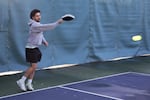 A player pays attention to the pickleball game at hand at the Tanner Creek Park courts on Feb. 10, 2023. The city of West Linn has taken some noise reducing steps, such as hanging this rubber mat around the Tanner Creek pickleball courts.
