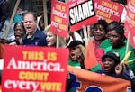Dec. 13, 2000: Supporters of Democratic presidential candidate Al Gore march to the Florida State Capitol to rally against the legislature's intention to name a slate of electors favorable to Republican presidential candidate George W. Bush.