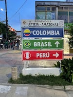 Street signs in Leticia, Colombia at the intersection of three countries.