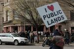 A counterprotester holds a sign across the street from a rally in support of LaVoy Finicum outside the federal courthouse in Portland on March 5, 2016.