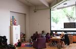 Children play and paint in the children's area at the Rosewood Initiative.