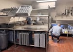 Mike Christman,  a registered environmental health specialist for Multnomah County, conducts a routine inspection of Black Bear Diner on May 13, 2026.