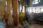 FILE-A window provides a look into the construction underway at Portland City Hall, May 15, 2024, where crews are renovating the city council chambers to accommodate the expanded 12-person council, as approved by voters in 2022.