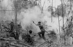 North Vietnamese Army officer leads an attack on South Vietnamese forces. Laos 1971.