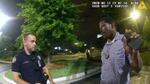 This screen grab taken from body camera video provided by the Atlanta Police Department shows Rayshard Brooks, right, as he speaks with Officer Garrett Rolfe, left, in the parking lot of a Wendy's restaurant in Atlanta on June 12, 2020.