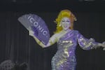 Drag artist BinKyee Bellflower performing at the Portland Drag-A-Thon. 
